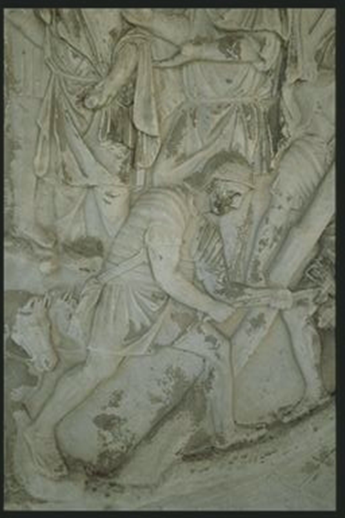 Legionary cutting wood