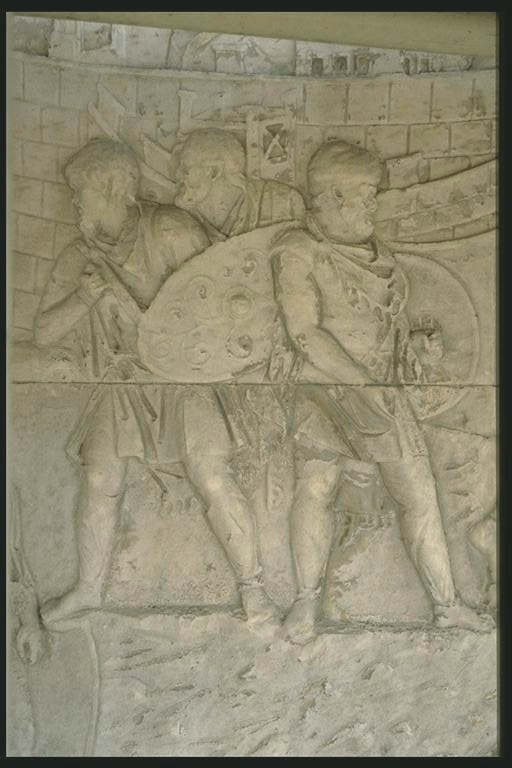 Three Dacians outside their fortress