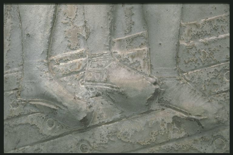 Feet of Romans on a bridge