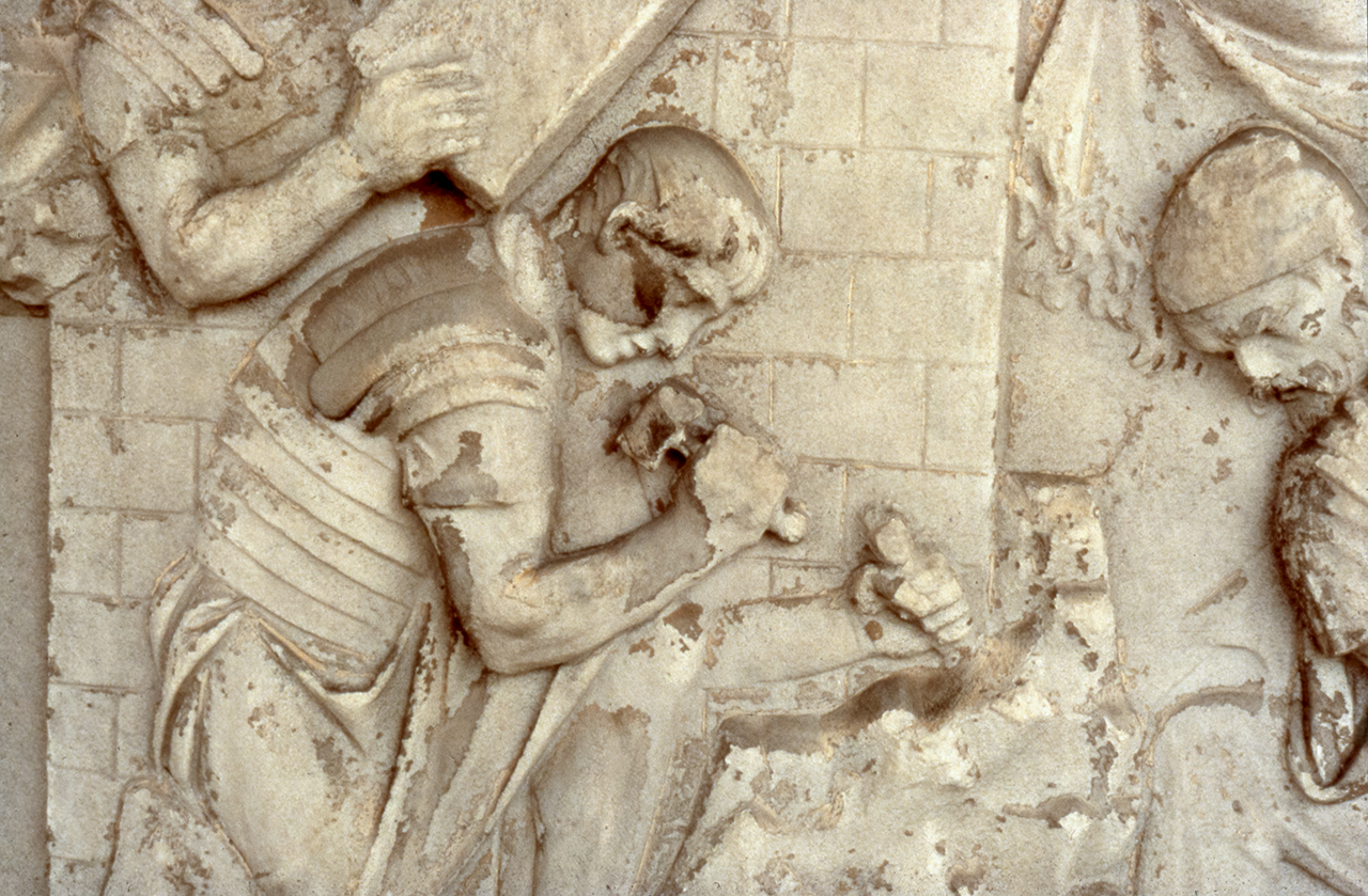 Legionary cutting stone
