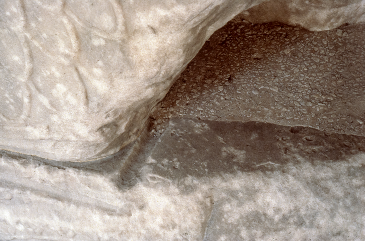 Lead-pour channel at junction of base and torus