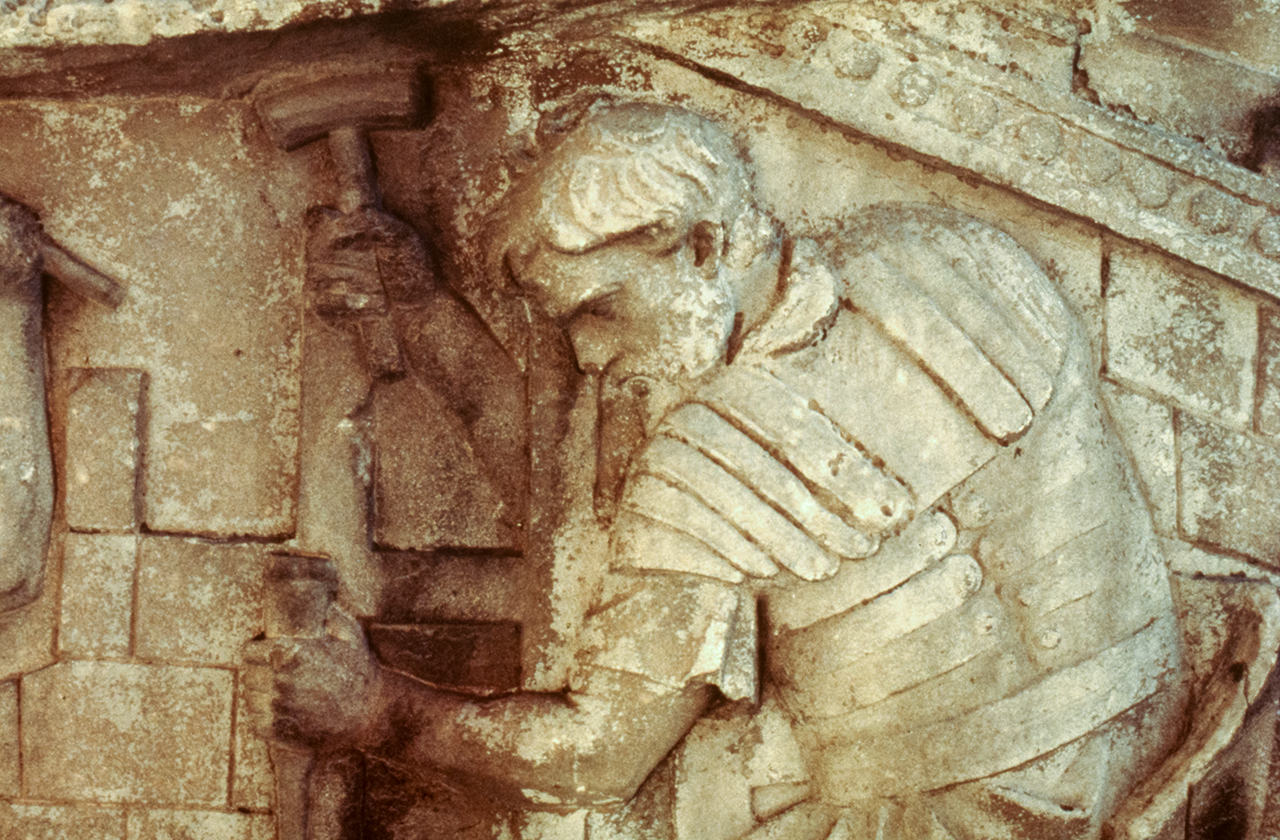 Legionary hammering a stake